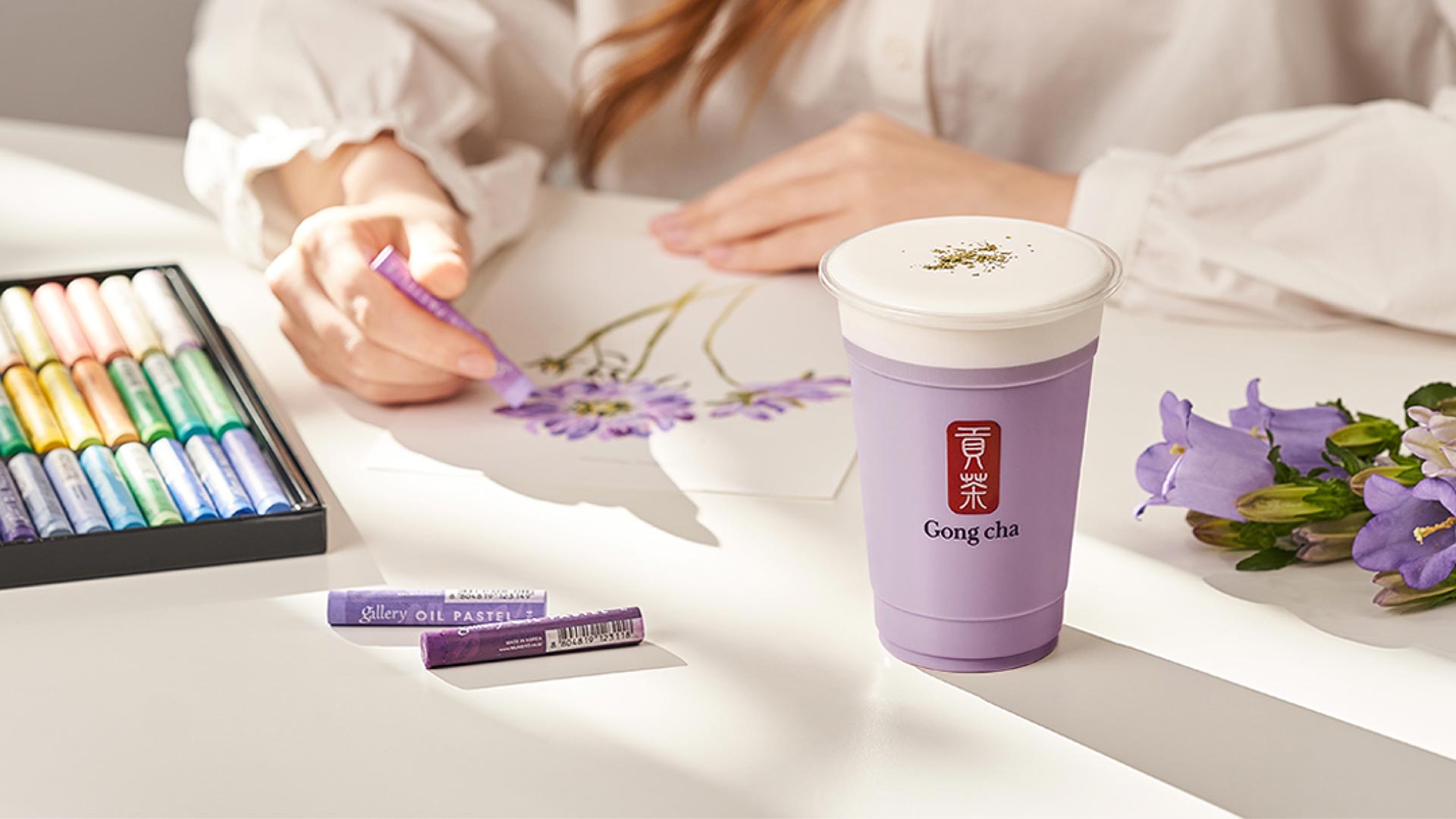 Gong cha drink on table while drawing