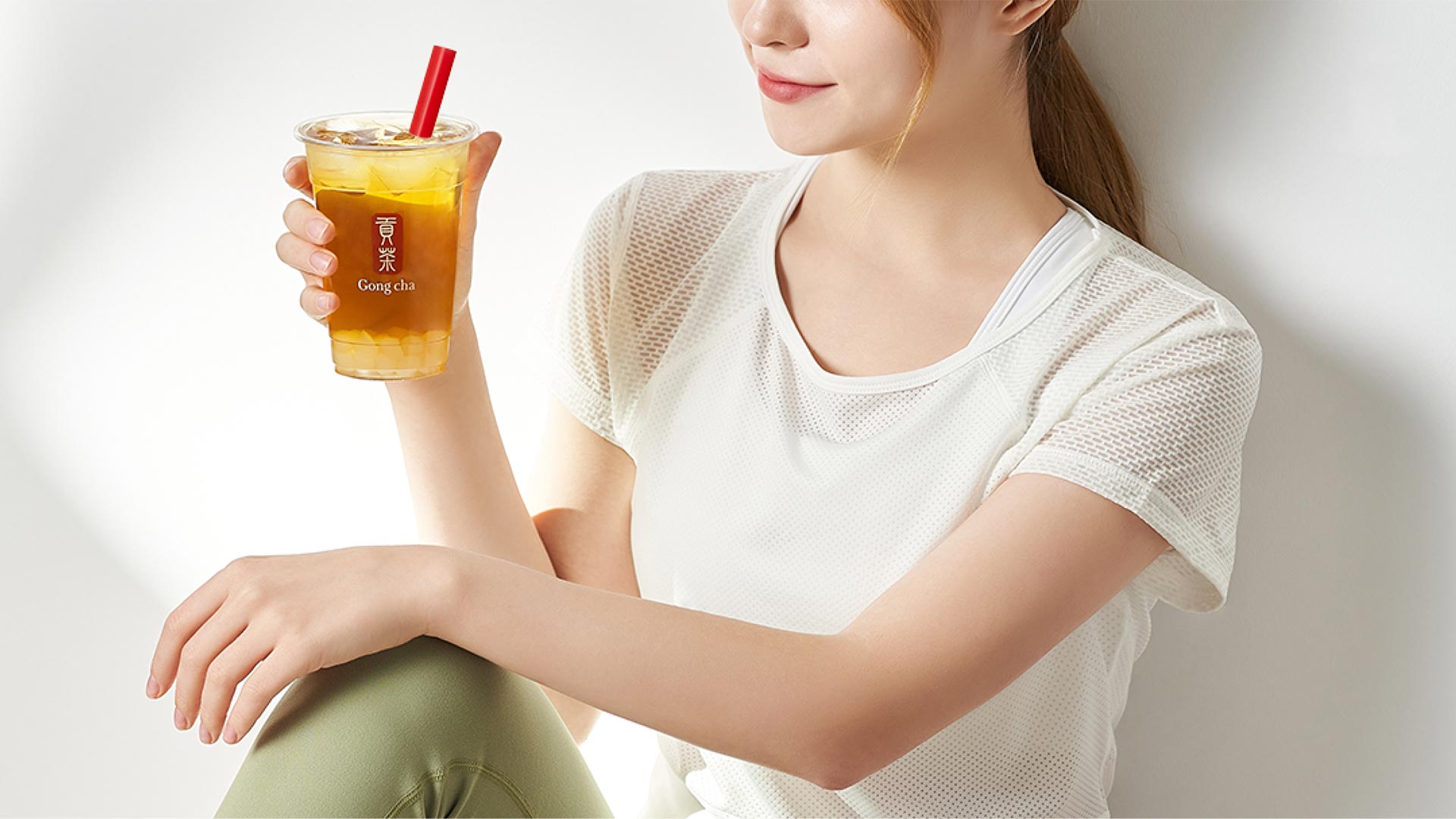 Woman holding a Gong cha drink